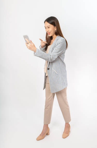 istock Young asian office lady with a phone 1398109203
