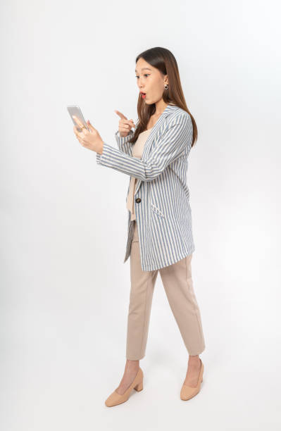 istock Young asian office lady with a phone 1398109241