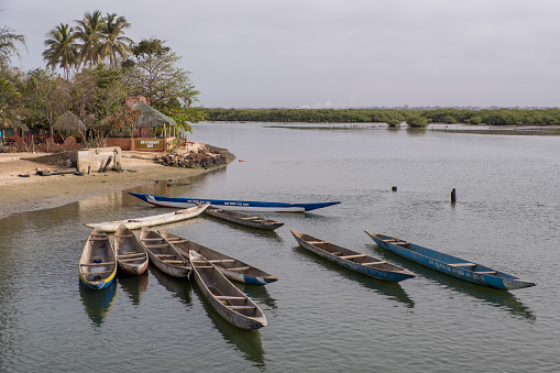 Joal, Senegal - June 27, 2019: Canoes in the waters of Joal - Fadiouth on the Senegalese coast