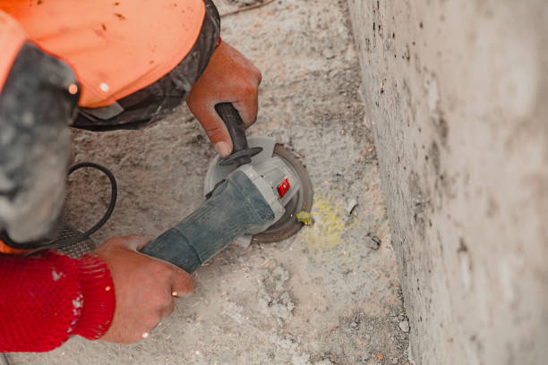 istock View of a worker at a construction site working with a rock-drill and digging the ground 1398110714