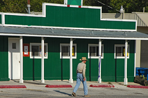 Texas, USA - September 23, 2006: Scene with an old cowboy on a main street in the town of Bandera