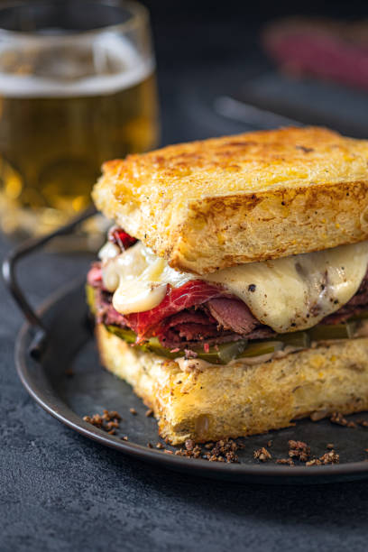 istock Sandwich with beef pastrami on wooden board 1398111470