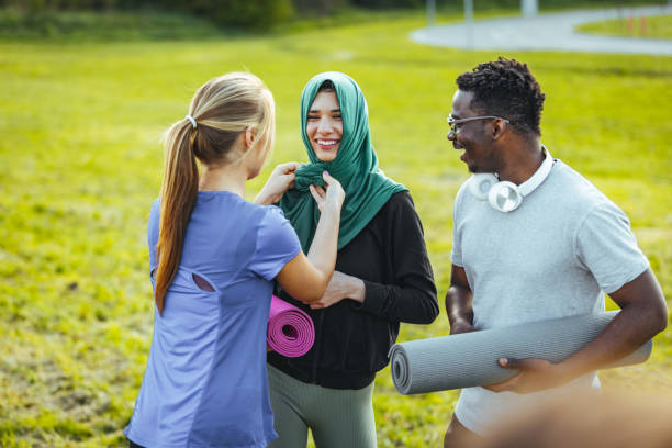 istock Two friends fixing the hijab outdoor before start training 1398112796