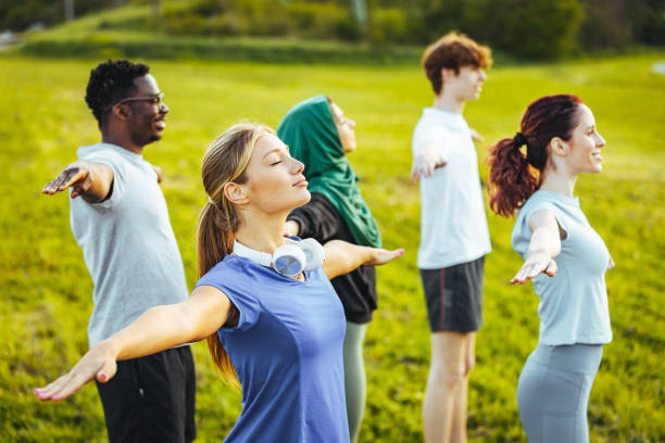 istock Meditating together during yoga practice outside 1398114611