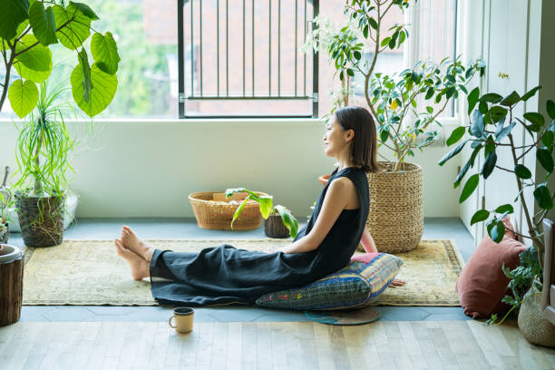 istock A woman relaxing surrounded by foliage plants 1398114735
