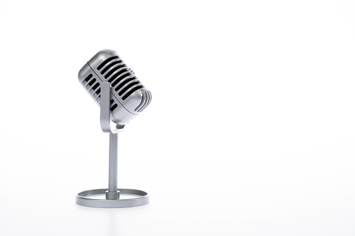 Retro microphone on white background.