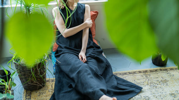 istock A woman relaxing surrounded by foliage plants 1398115660