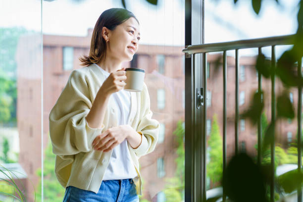 istock A woman relaxing surrounded by foliage plants 1398116357