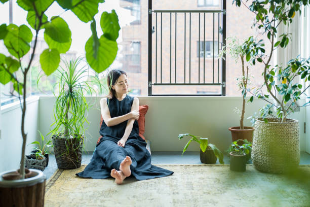 istock A woman relaxing surrounded by foliage plants 1398116508