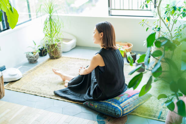 istock A woman relaxing surrounded by foliage plants 1398116522