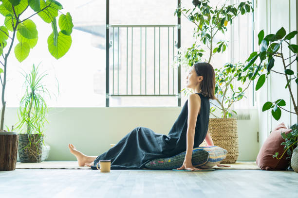 istock A woman relaxing surrounded by foliage plants 1398117232
