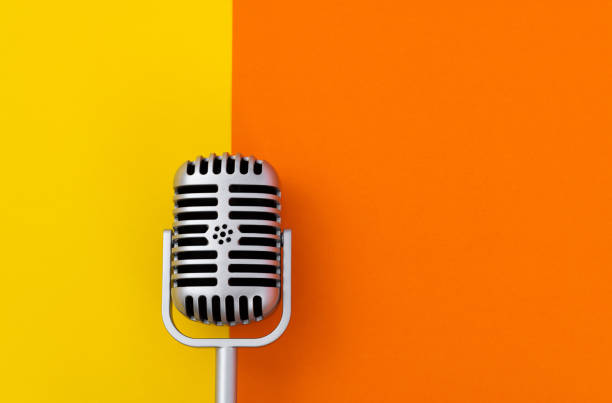 Retro microphone on colored background stock photo