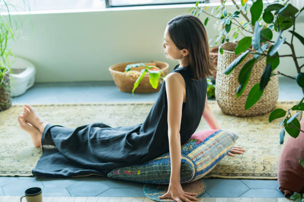 istock A woman relaxing surrounded by foliage plants 1398117492