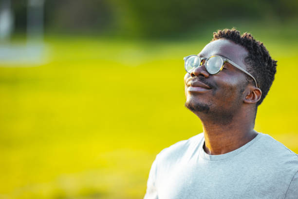 Relaxed man breathing fresh air.