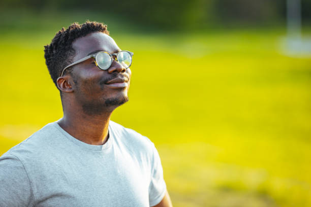 istock Calm man meditating in sunny summer day 1398117876