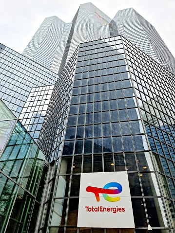 The Tour Total building now serves as headquarters for TotalEnergies. The  office building in La Défense with a height of 187 m was planned by WZMH Architects, Roger Saubot and realized between 182 and 1985. The image was captured during springtime.