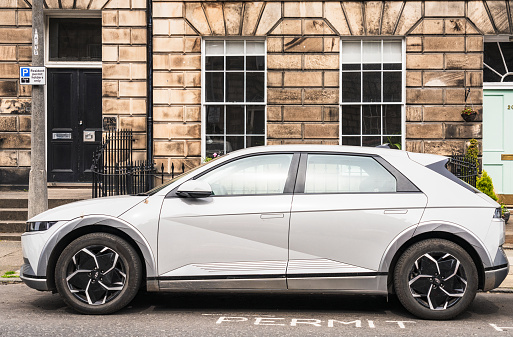 Edinburgh, Scotland - Side view of a Hyundai Ioniq 5 electric car, parked on a street in the city's New Town.