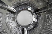 Drum of the washing machine from the inside, copy space