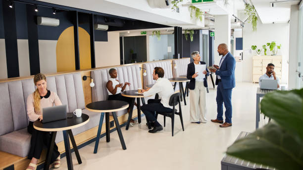istock Diverse businesspeople working in an office lounge area 1398123261
