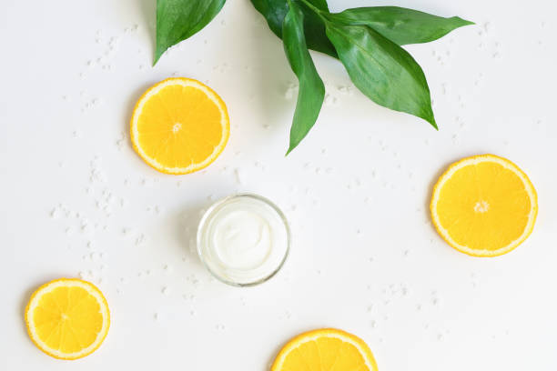 istock A jar of face cream on a white background with oranges 1398125034
