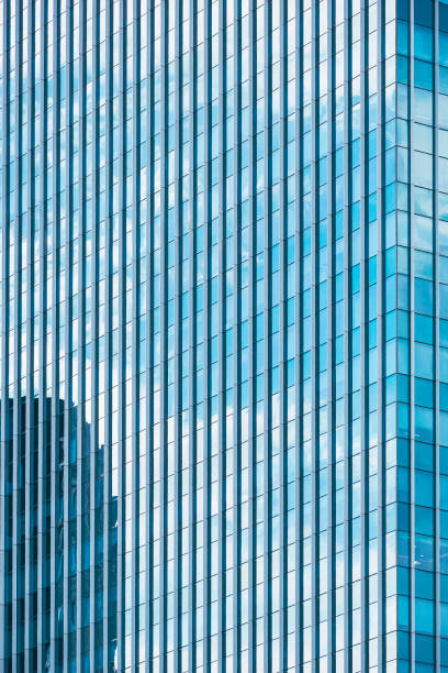 istock Background abstract line pattern on glass wall surface of skyscraper in vertical frame 1398125659