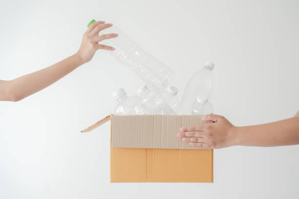 istock People launch a campaign to recycle used empty plastic bottles. 1398128559