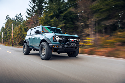 Seattle, WA, USA\nFeb 2, 2022\nCactus Grey Ford Bronco driving on the highway to get roller shots.