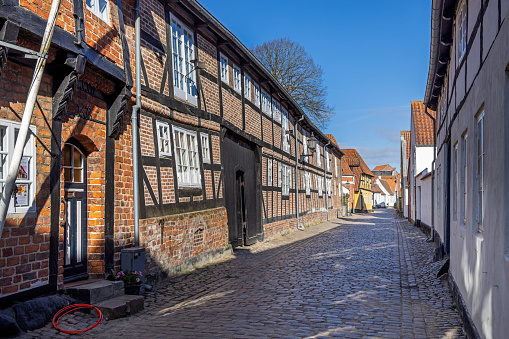 Old street with cobblestones in Ribe, which is the oldest town in Denmark and is situated to the south west on the peninsular Jutland
