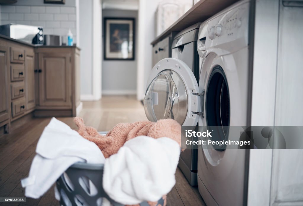 Shot of a laundry basket filled with freshly dried clothes Fresh and unfolded Dryer Stock Photo