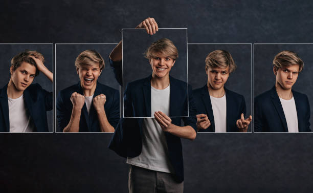 istock young man holding face portraits with different emotions 1398134736