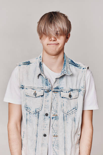 istock Handsome young man with trendy hairstyle posing 1398135371