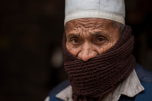 Kathmandu, Nepal- April 20,2019 : Portrait of older Nepalese in Patan Durbar Square.
