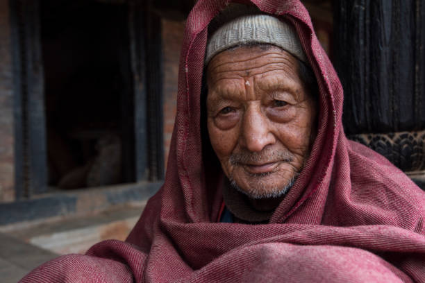Kathmandu, Nepal- April 20,2019 : Portrait of older Nepalese in Patan Durbar Square.