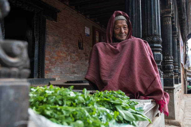 Kathmandu, Nepal- April 20,2019 : Portrait of older Nepalese in Patan Durbar Square.