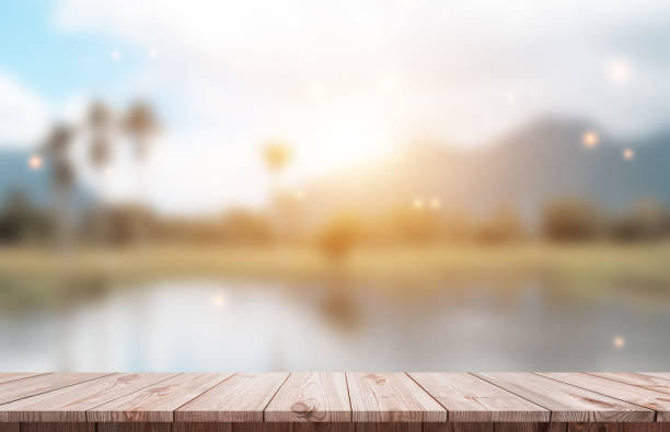 istock Wood table top and blur glass window For montage product display 1398139366
