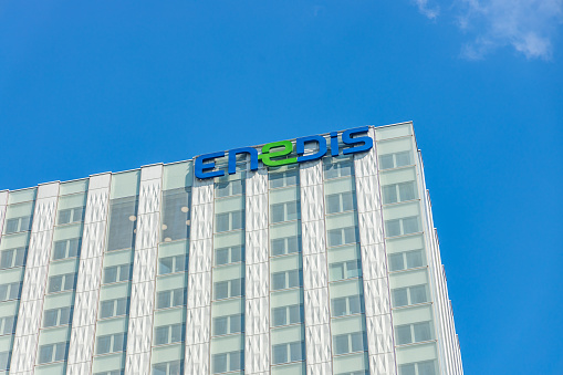 Enedis logo on the Tour Blanche tower, the headquarters of the French company in La Defense business district in Paris France