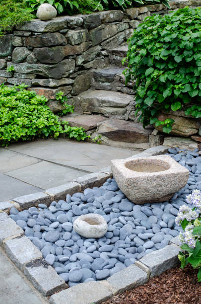 istock Pretty Garden Path with Flowers and Garden Bench 1398142001