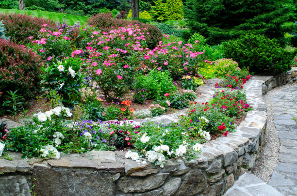 istock Pretty Garden Path with Flowers and Garden Bench 1398142008