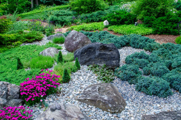 istock Pretty Garden Path with Flowers and Garden Bench 1398142590