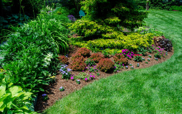 istock Pretty Garden Path with Flowers and Garden Bench 1398142614