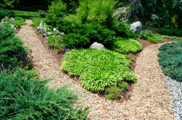istock Pretty Garden Path with Flowers and Garden Bench 1398142691