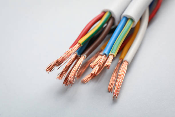 istock Cables with stripped wires on light background, closeup 1398143156