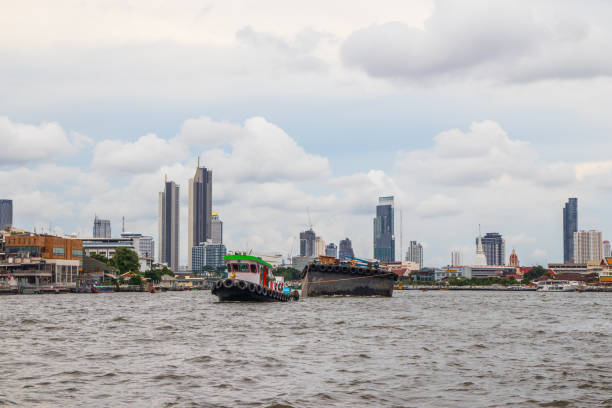 istock A Tug boat with a cargo ship on the Chao Phraya River in Bangkok Thailand 1398144180