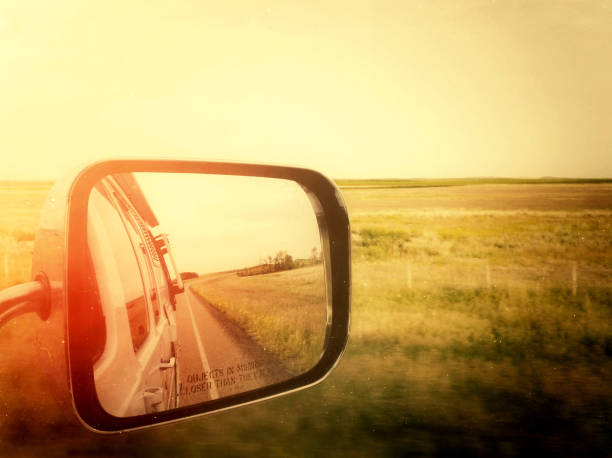 View from a moving vehicle overlooking the Canadian prairies landscape in Saskatchewan, Canada.