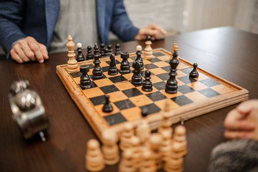 Close up photo of chess board with remaining chess pieces