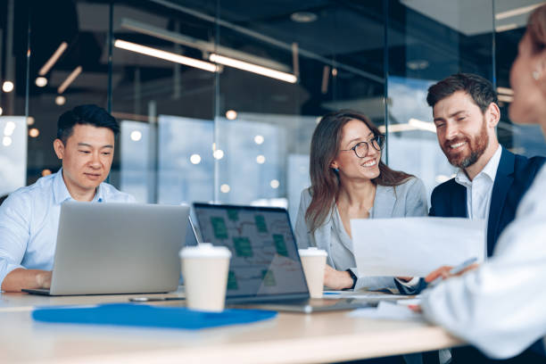 istock Positive business team working on new project in modern office 1398149463