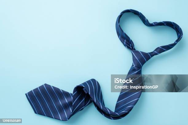 Fathers Day Concept Top View Photo Of Heart Shaped Blue Necktie On Isolated Pastel Blue Background With Copyspace Stock Photo - Download Image Now