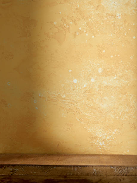istock yellow wall and brown shelf 1398150684
