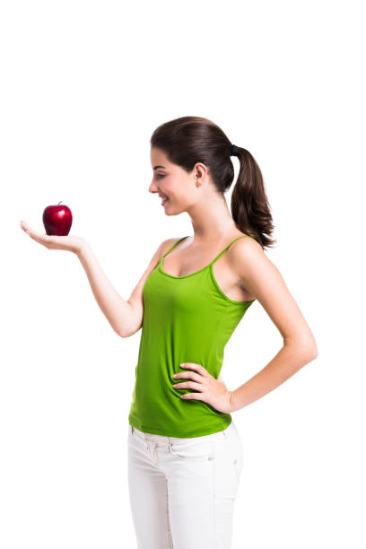 istock Healthy woman holding an apple 1398150966