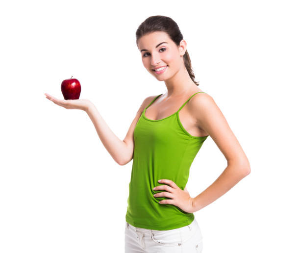 istock Healthy woman holding an apple 1398150967